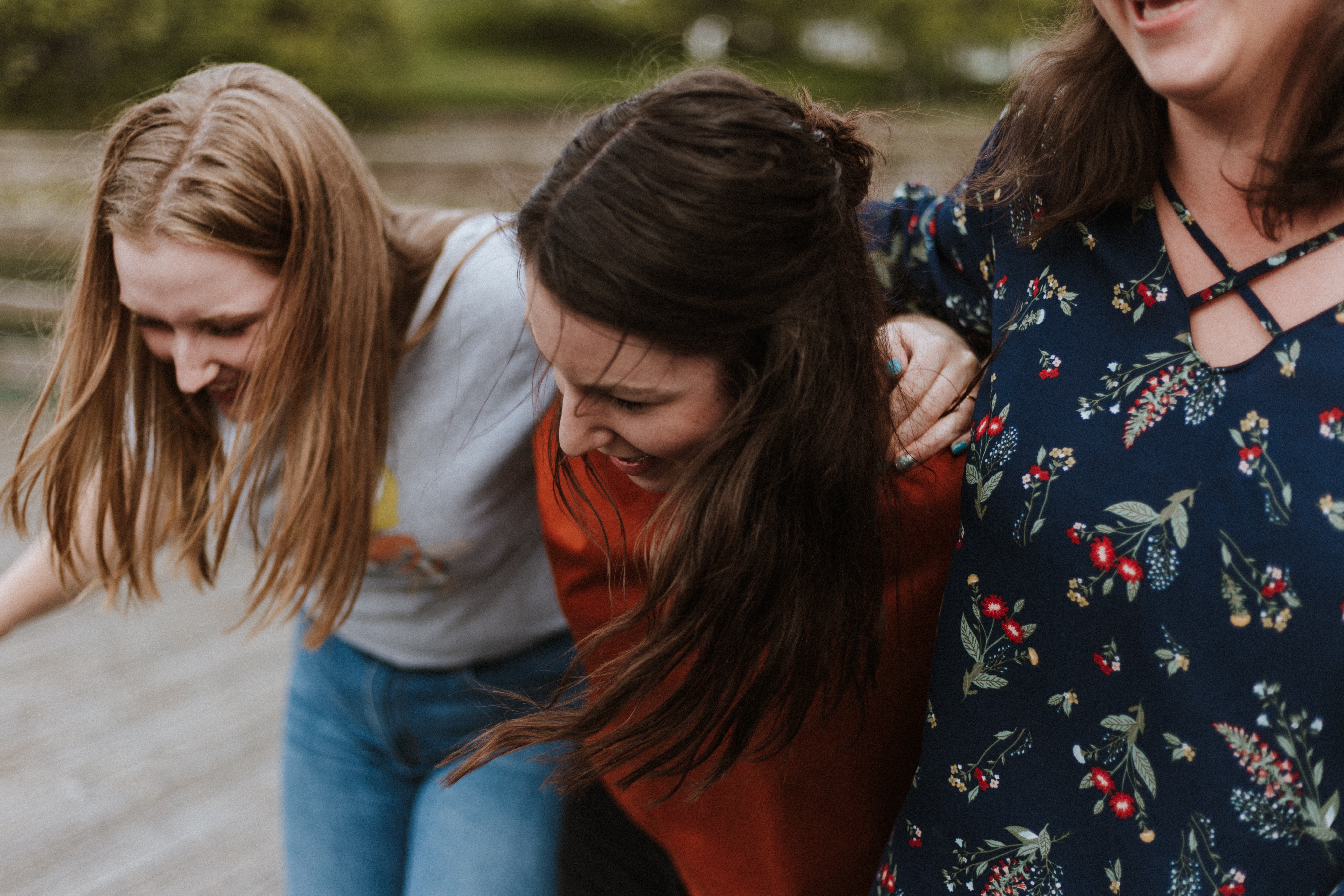 Women with arms around each other