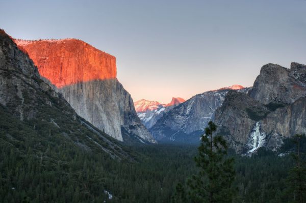 Looking up Yosemite Valley from Highway 41 at Sunset, El Capitan on the left and Bridal Veil on the right