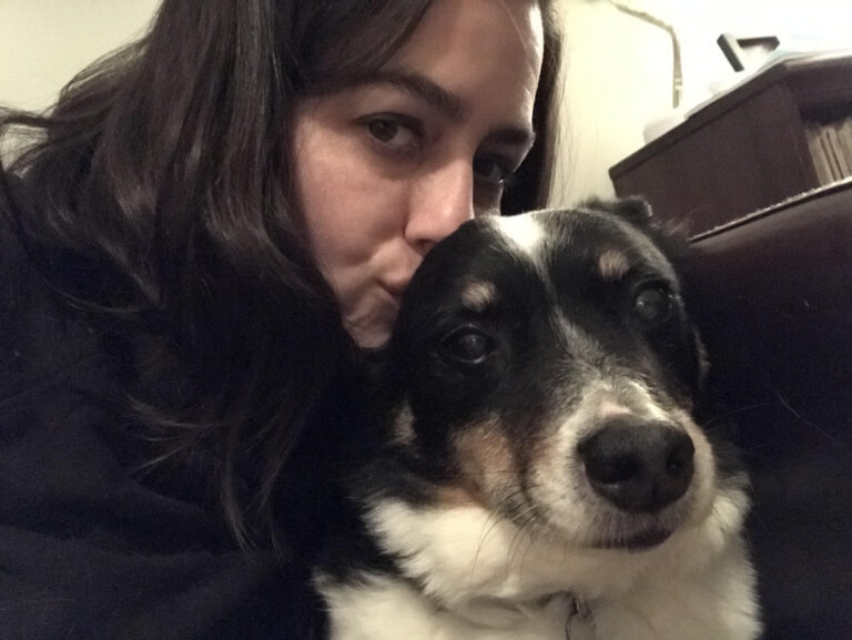 Lady smooching her dog