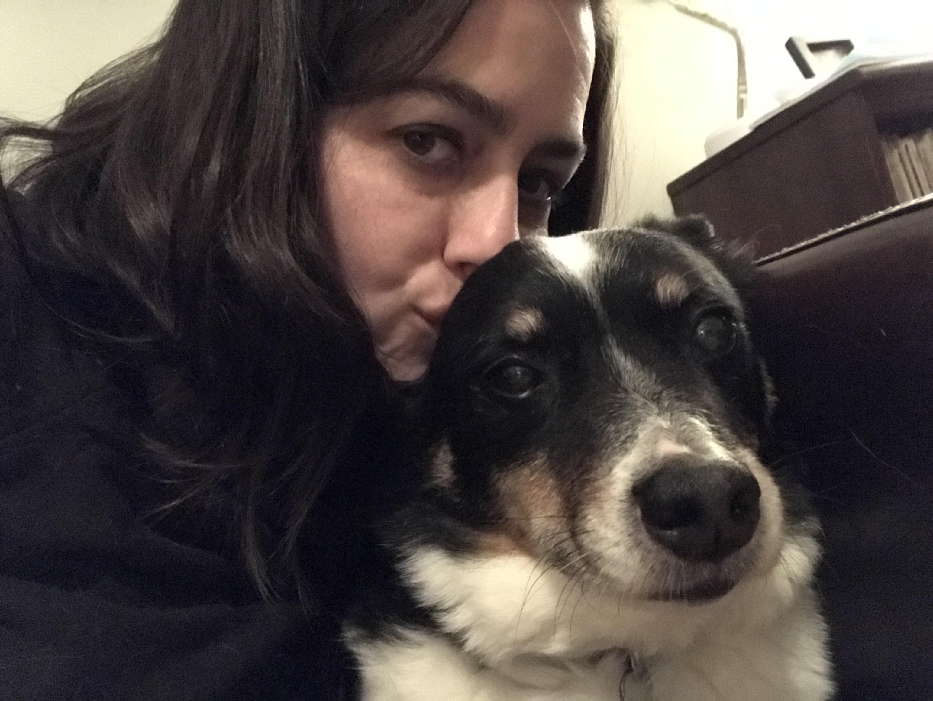 Lady smooching her dog